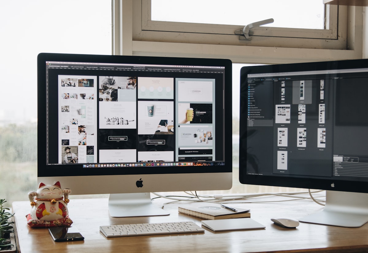 A custom website design laid out across a designer's screen